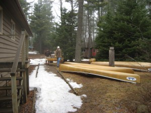 Shuffling the canoes from the dining hall to the canoe yard