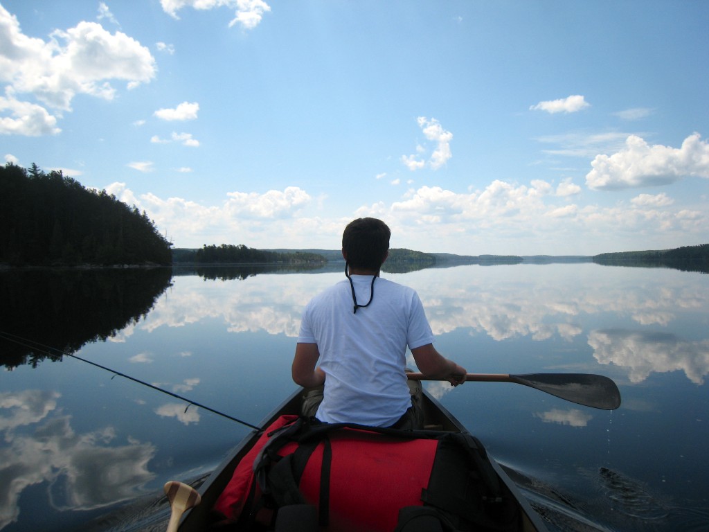 Quetico Provincial Park paddling reflection Ontario canoe trip boundary waters 