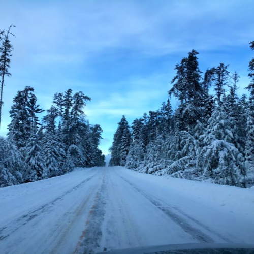 The snow-covered Gunflint Trail Road in northern Minnesota outside of Grand Marais, MN 